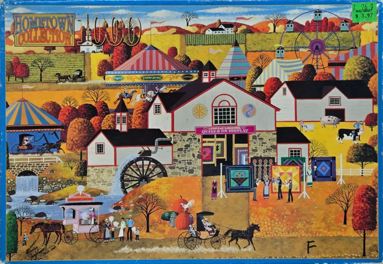 Folk art scene of a rural county fair featuring a watermill, quilt display, and amusement rides in autumn.