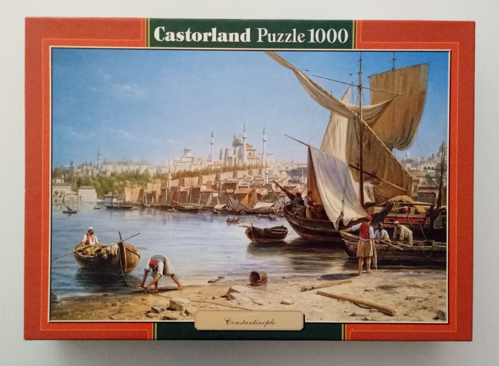 Oil painting of the harbor of Constantinople with traditional sailing boats and figures on the shore.