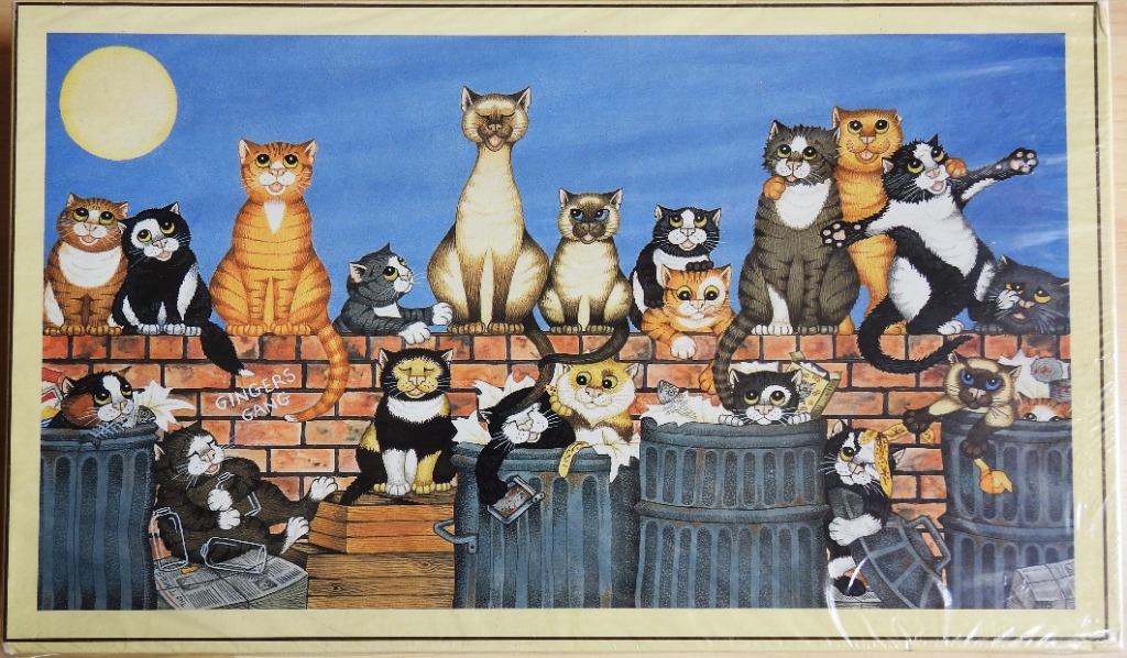 An illustration of many diverse cats perched on a brick wall and sitting in trash cans against a blue night sky.