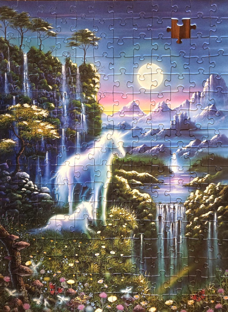Fantasy landscape featuring two glowing white unicorns by a waterfall under a full moon.