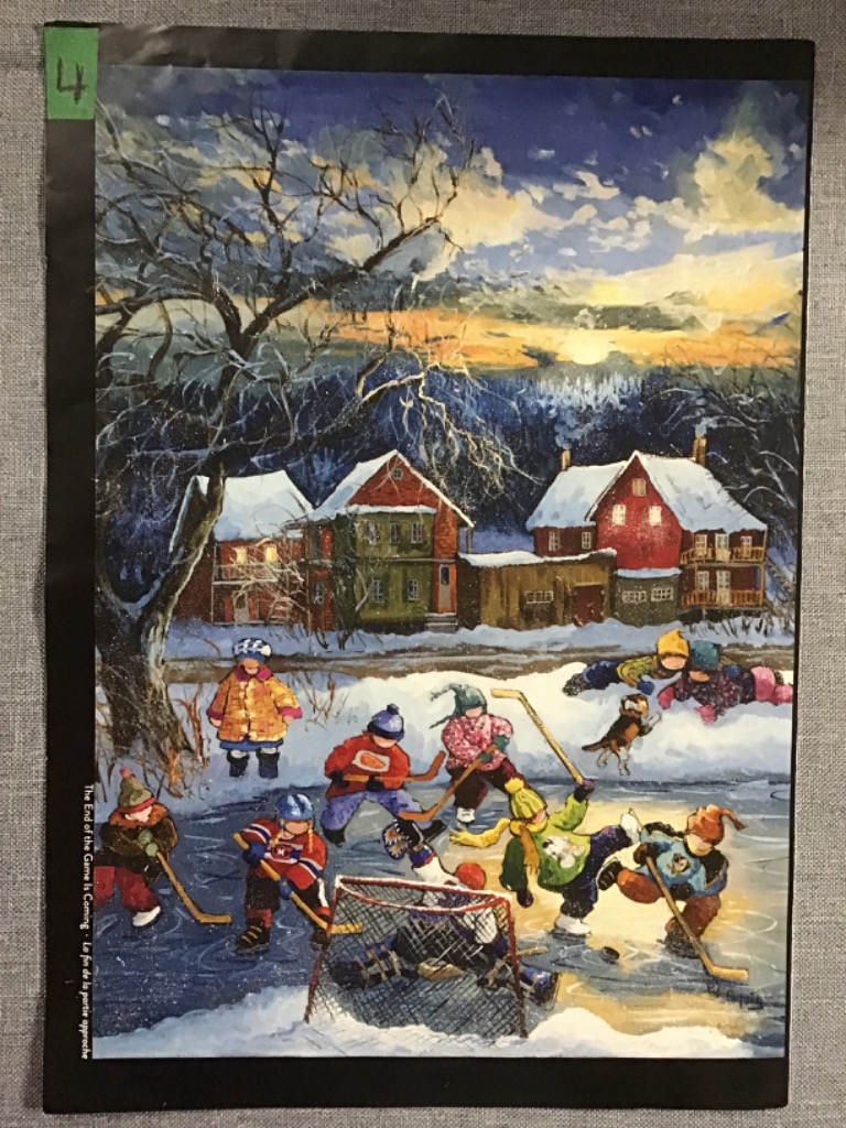 Children playing hockey on a frozen pond in a snowy village at twilight.