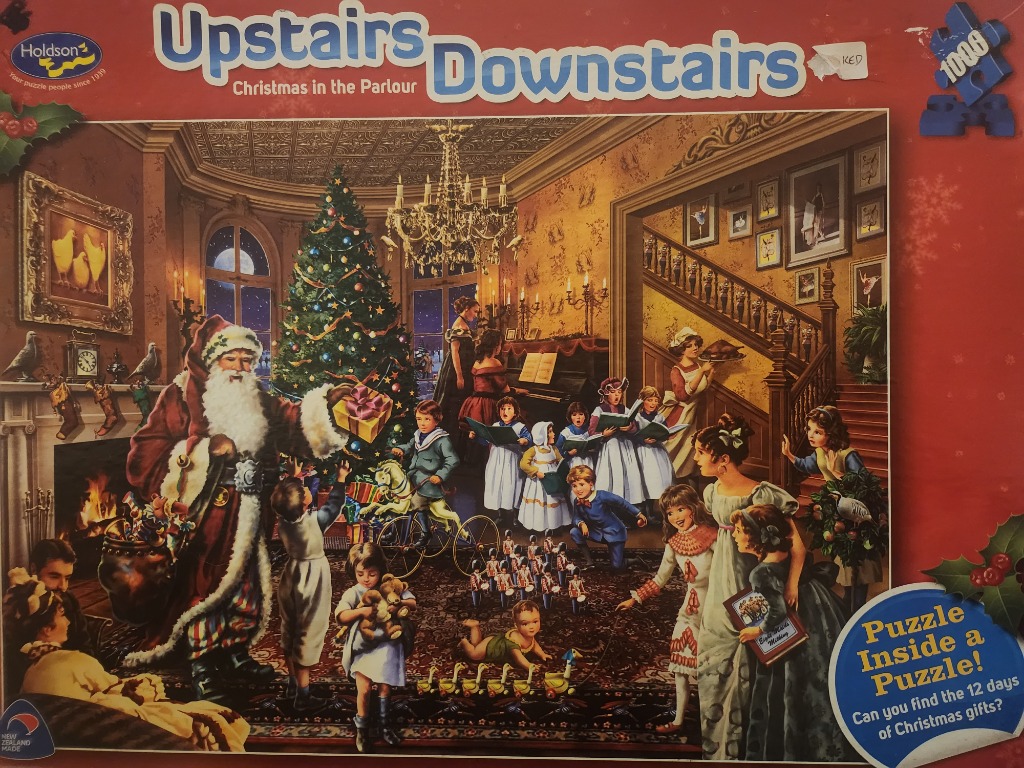 A Victorian-era parlour scene with Santa Claus and children celebrating Christmas.
