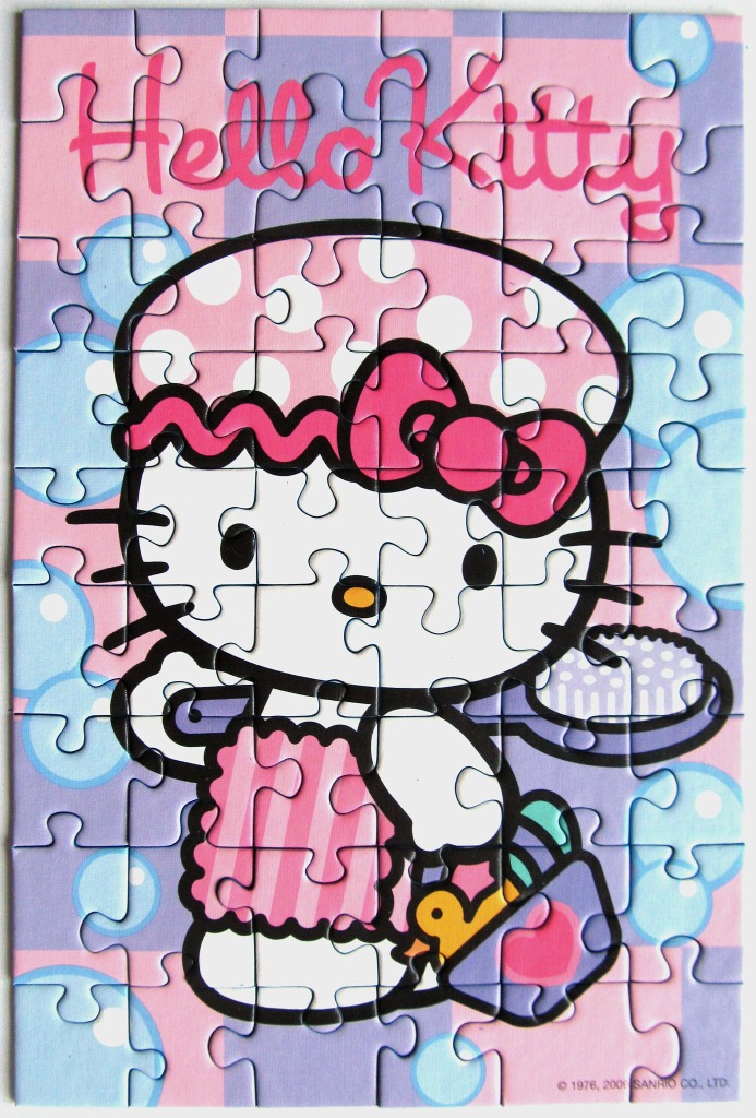 Hello Kitty character in a pink shower cap and apron with blue bubbles in the background.