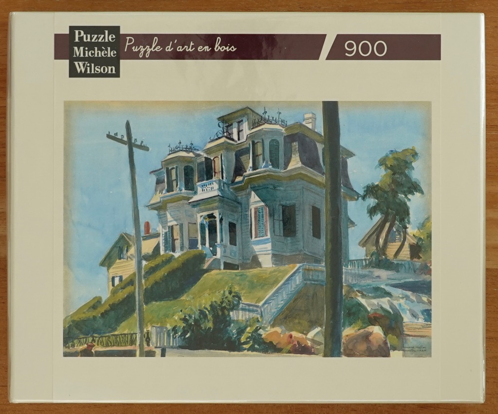 Watercolor painting of a Victorian-style house sitting on a grassy hill.