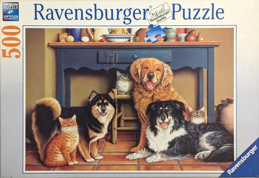 A group of dogs and cats resting together under a wooden kitchen table.