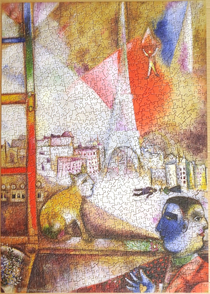 A surreal expressionist painting featuring a cityscape, a floating figure, and a split-faced portrait.