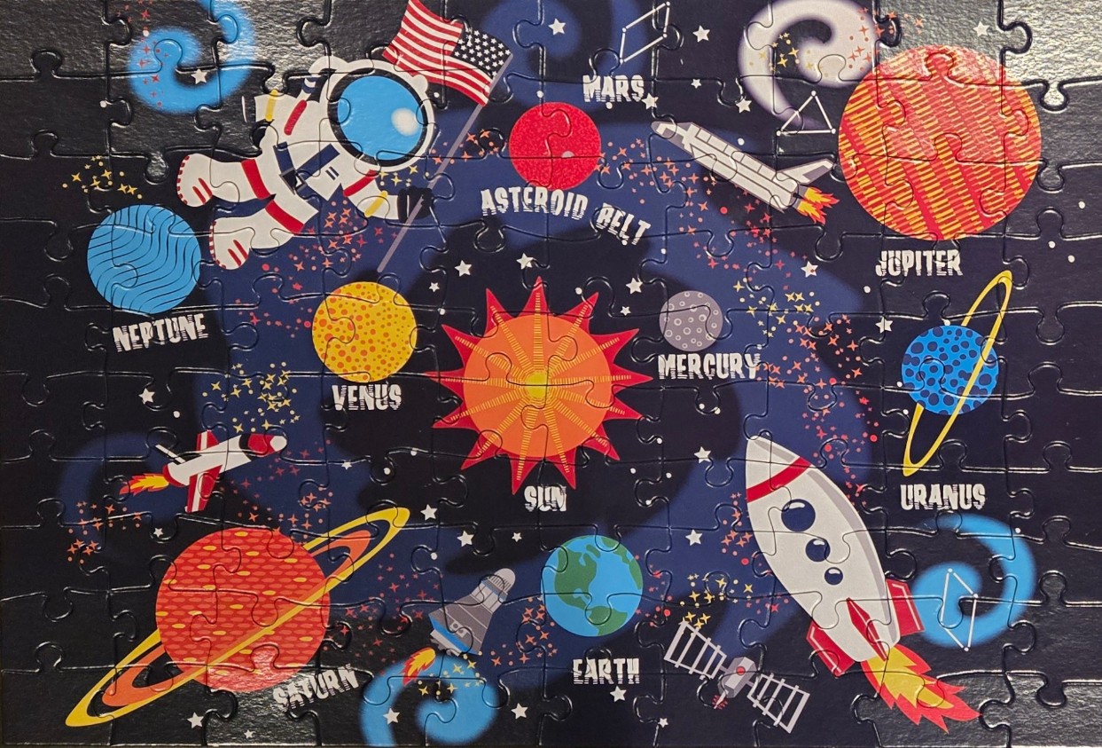 Cartoon illustration of the solar system featuring planets, a sun, rockets, and an astronaut on a dark blue background.