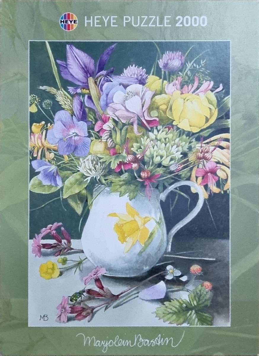 Watercolor painting of a bouquet of wildflowers in a small white pitcher on a grey table.