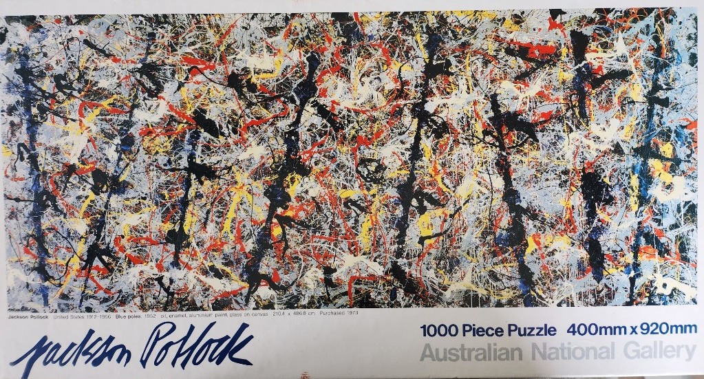 Abstract expressionist drip painting by Jackson Pollock featuring chaotic lines of black, red, yellow, and blue.