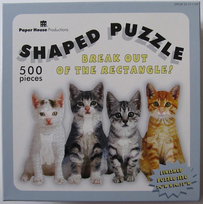 Four kittens of various colors sitting side-by-side on a light background