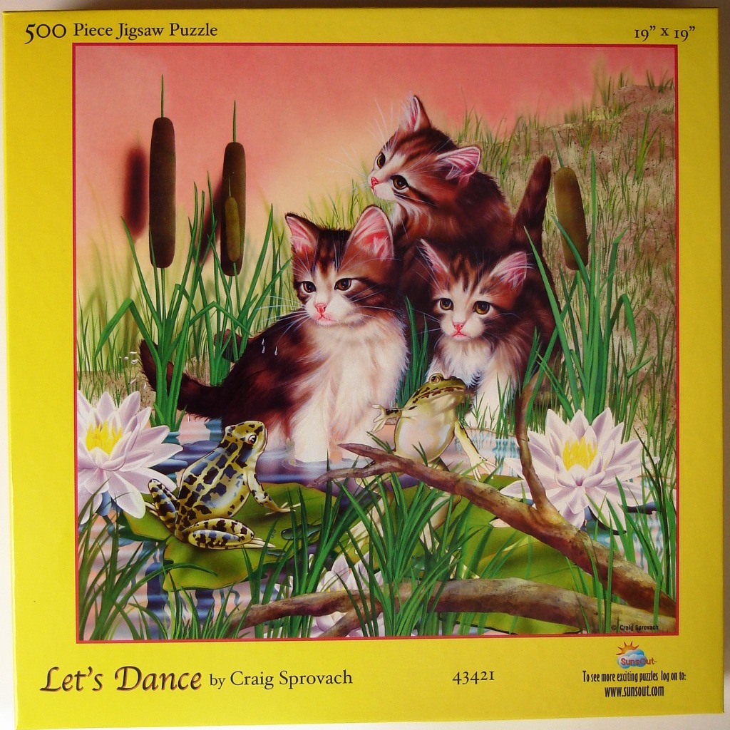 Three fluffy kittens watch two frogs sitting on lily pads in a pond at sunset.