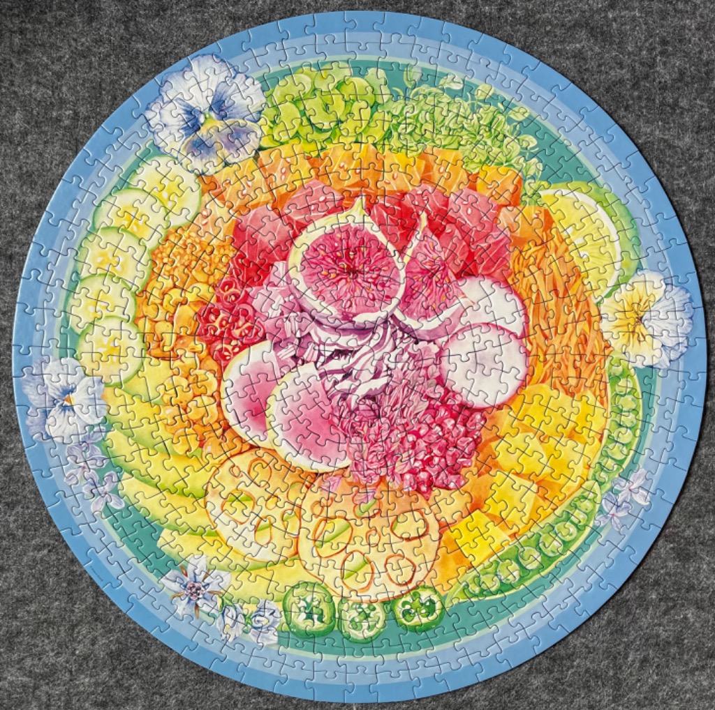 A circular illustration of a vibrant, multi-layered food bowl arranged in a mandala-like pattern.