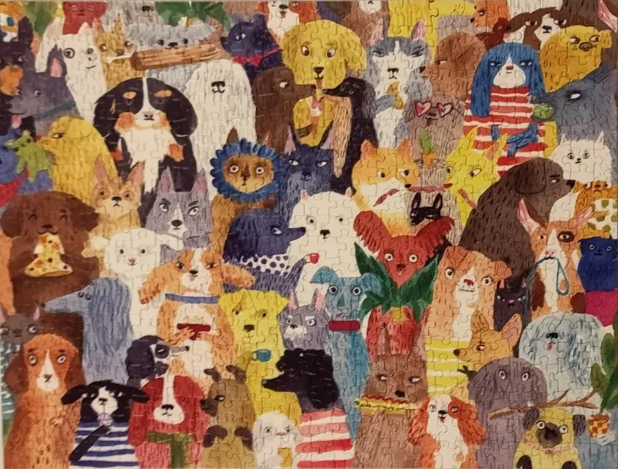 {"alt":"A dense illustration filled with dozens of expressive cartoon dogs of various breeds and colours.","description":"Th…