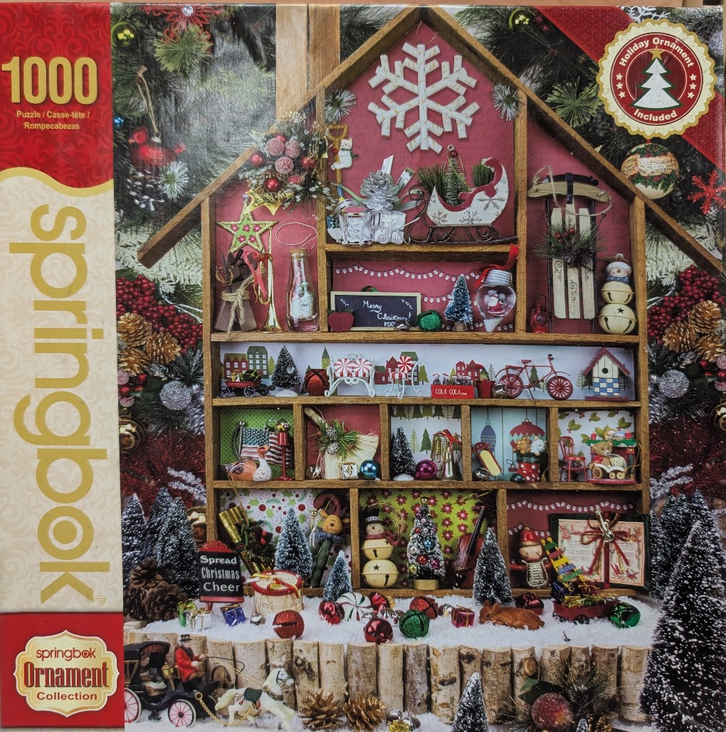 A wooden house-shaped shelf filled with diverse miniature Christmas ornaments and holiday decorations.