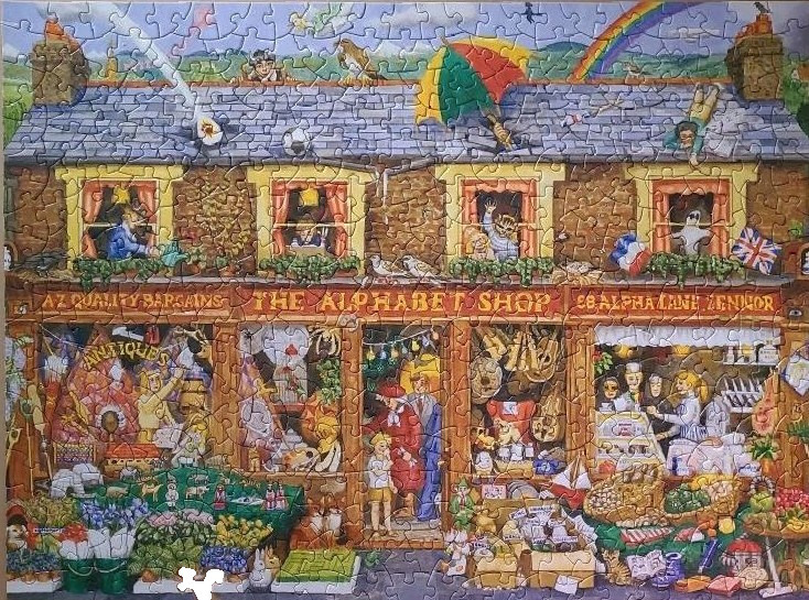 A whimsical illustration of a multi-story shop called The Alphabet Shop with many characters in the windows and storefront.