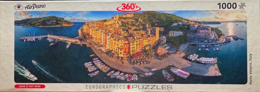 Aerial panoramic view of the colorful coastal town of Porto Venere, Italy, at sunset.