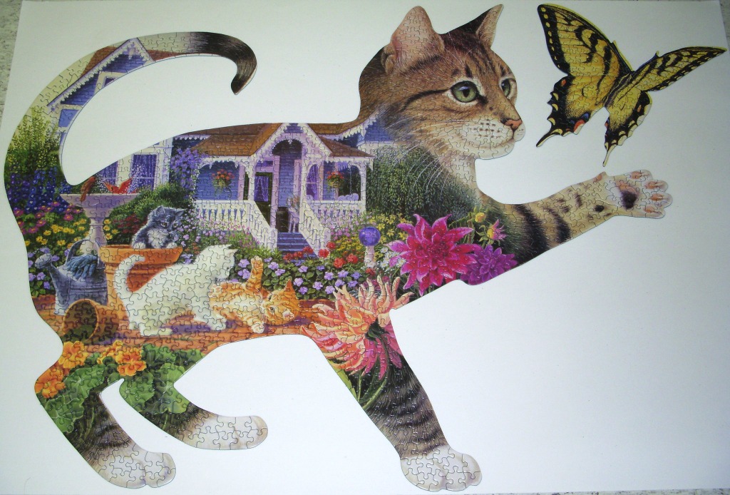 A cat-shaped image filled with a garden scene featuring a porch, kittens, flowers, and a large yellow butterfly.