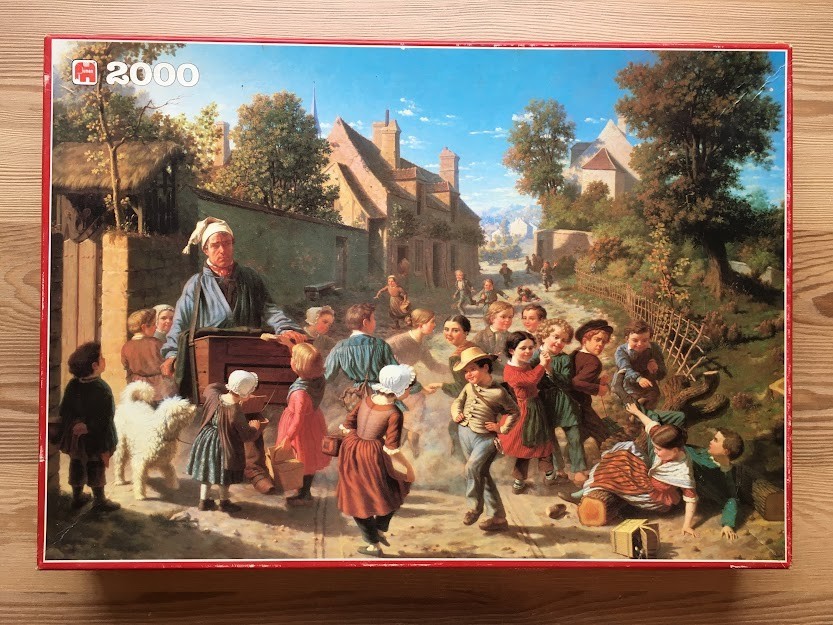 A detailed 19th-century style oil painting of a traveling organ grinder entertaining a crowd of children in a village.