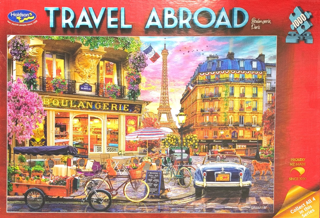Parisian street scene with a bakery, the Eiffel Tower, and a vintage car under a pink sunset.