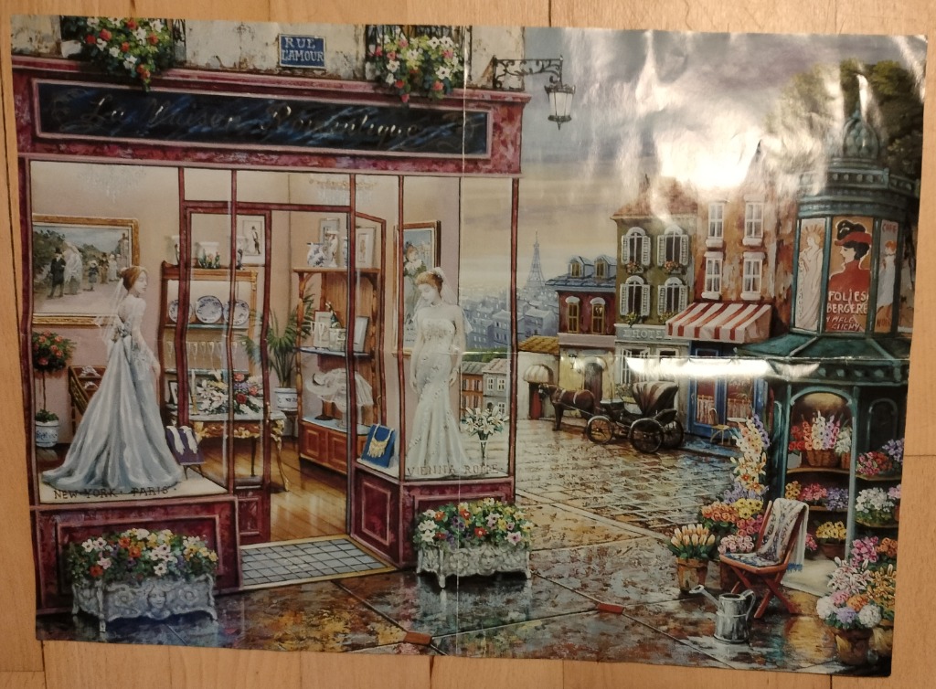 A romantic Paris street scene featuring a bridal boutique and a horse-drawn carriage.
