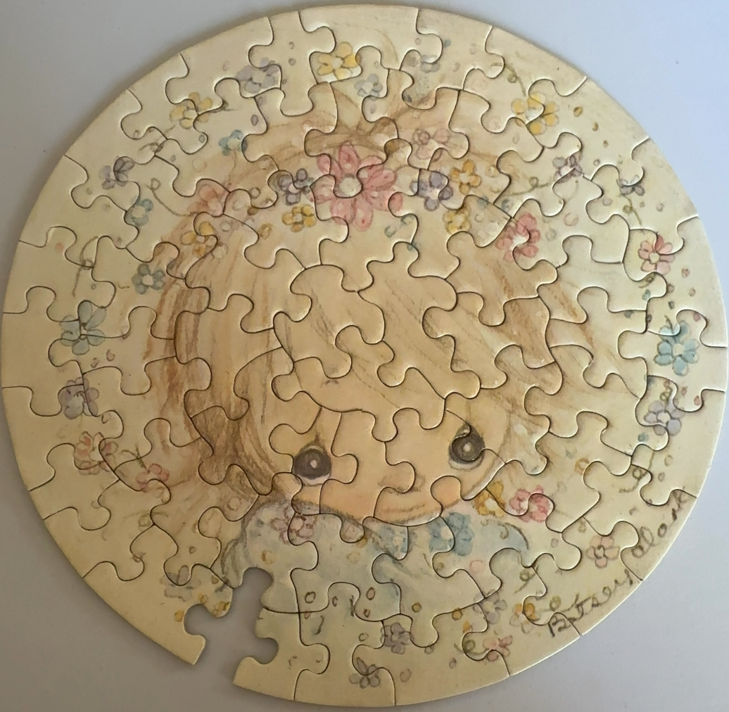 Circular illustration of a whimsical, wide-eyed girl with a flower crown in soft pastel colours.