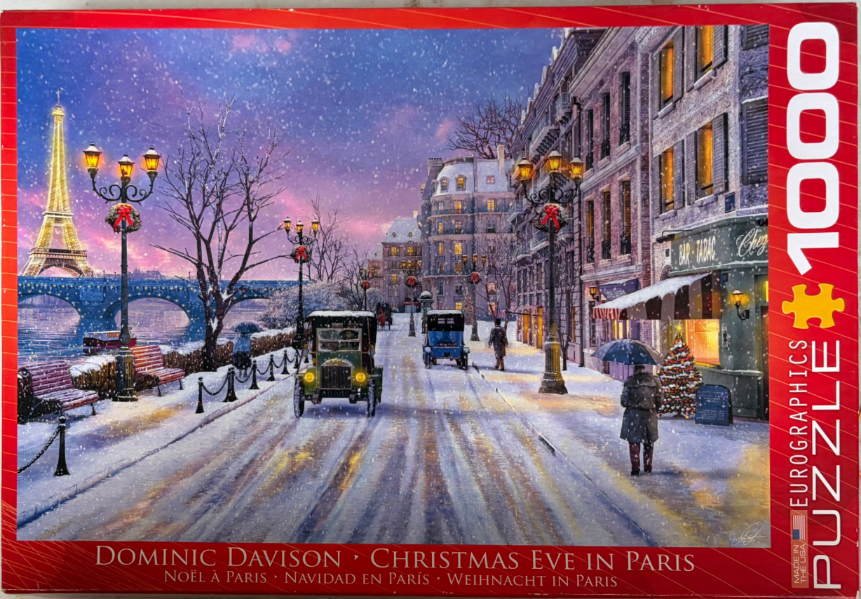 Snowy Parisian street at twilight with the Eiffel Tower in the background, vintage cars, and festive holiday decorations.