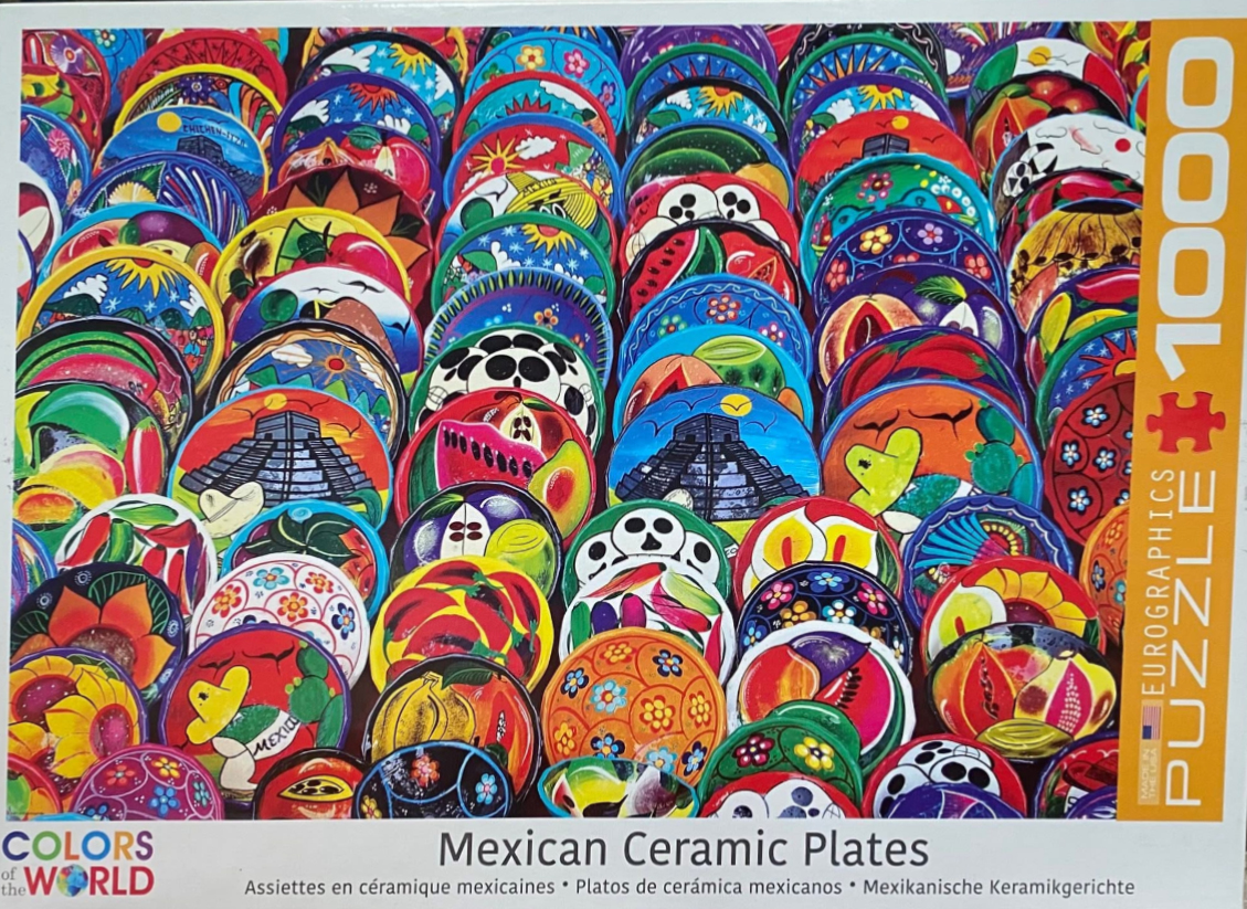A dense, vibrant collection of hand-painted Mexican ceramic plates featuring diverse cultural motifs.