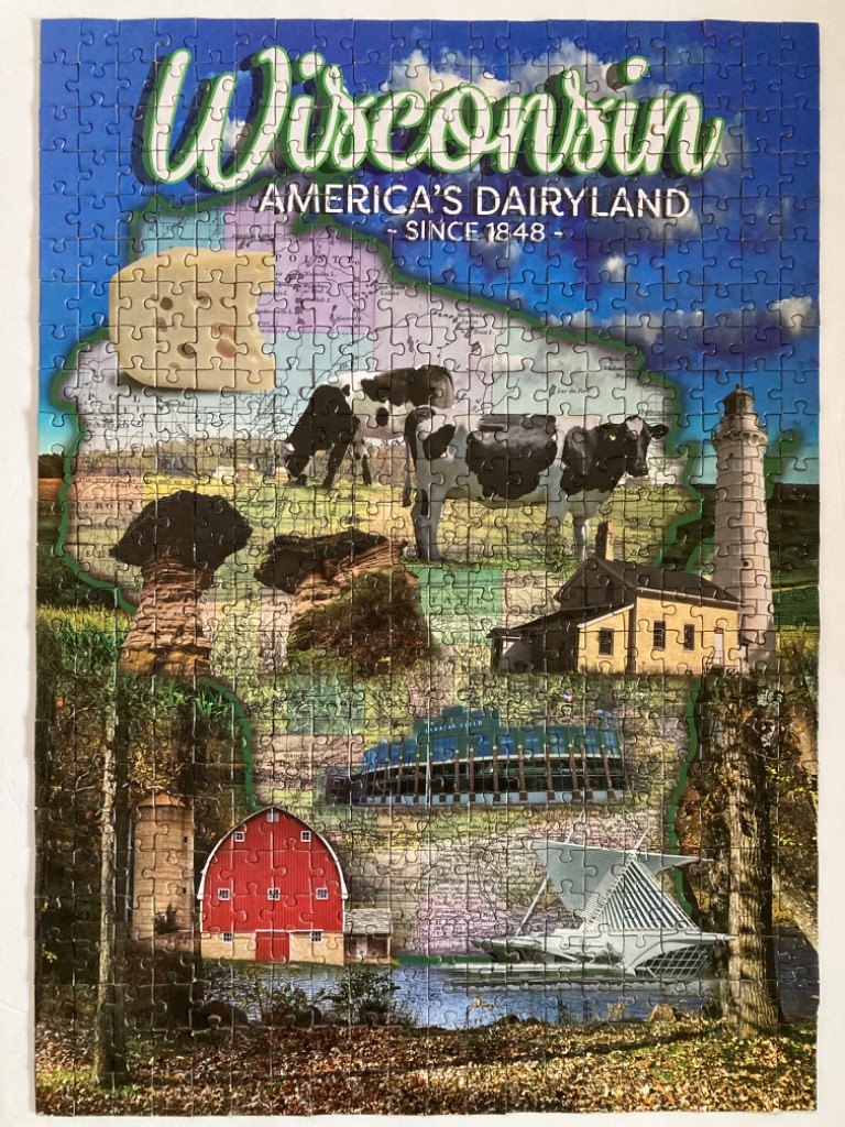A collage map of Wisconsin featuring state landmarks, a dairy cow, and local icons against a blue sky background.