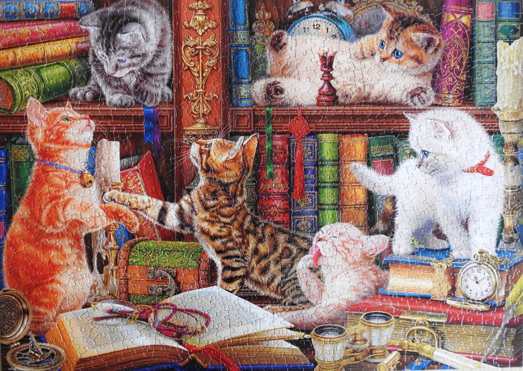 A cozy study filled with old books, vintage items, and five playful kittens.