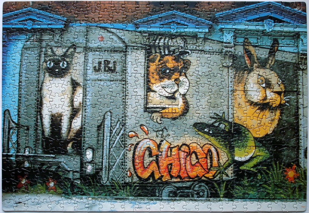Graffiti mural of a train car featuring a cat, a hamster, a rabbit, and a frog with the name Chico.