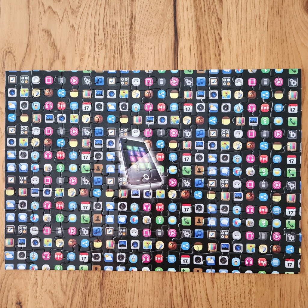 A central smartphone surrounded by a dense grid of colorful app icons on a dark background.