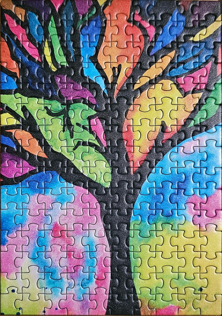 A stylized tree with a black silhouette and rainbow-coloured watercolor leaves and background.