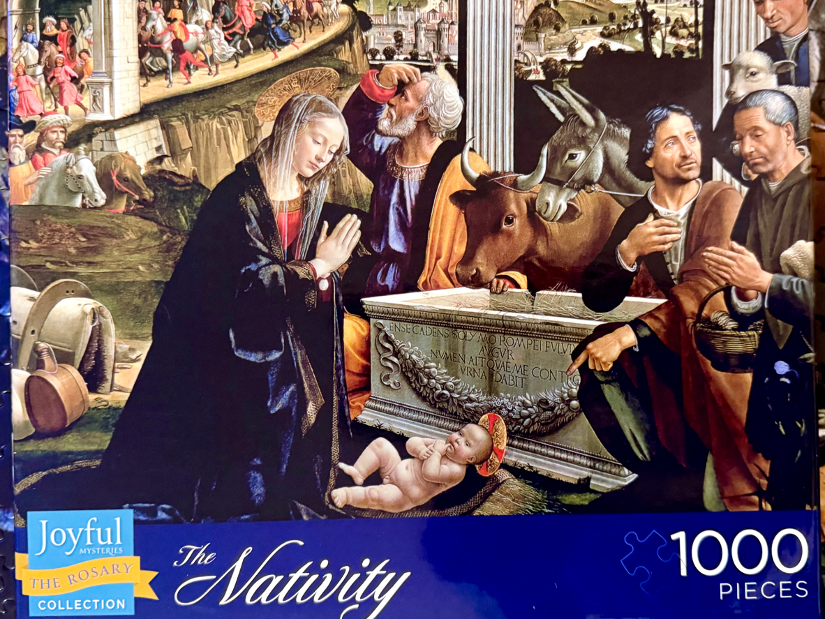 Renaissance-style nativity scene depicting the Virgin Mary, Joseph, and the infant Jesus near a stone sarcophagus.