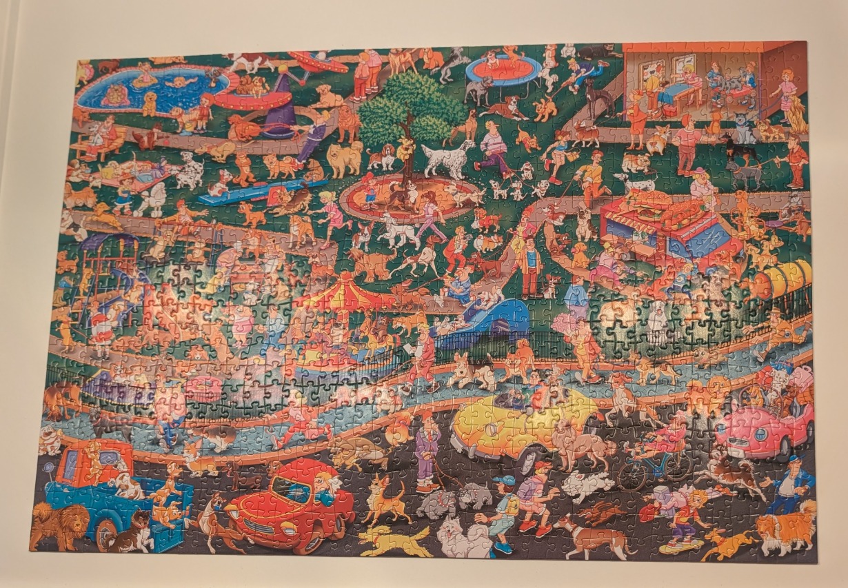An expansive cartoon illustration of a bustling park filled with many people and dogs of various breeds.