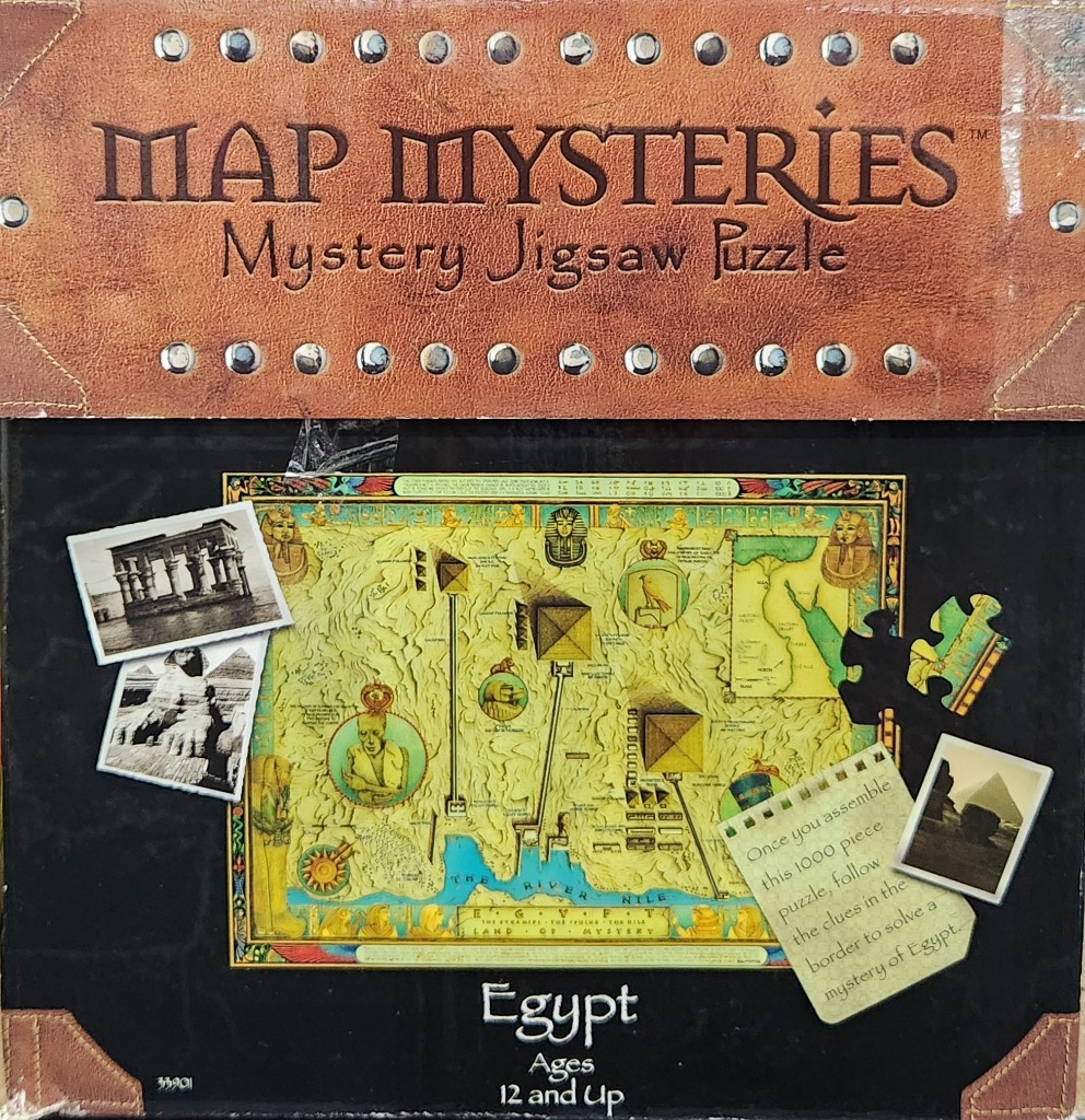 An illustrated map of ancient Egypt surrounded by photographs and a note, set against a dark background.