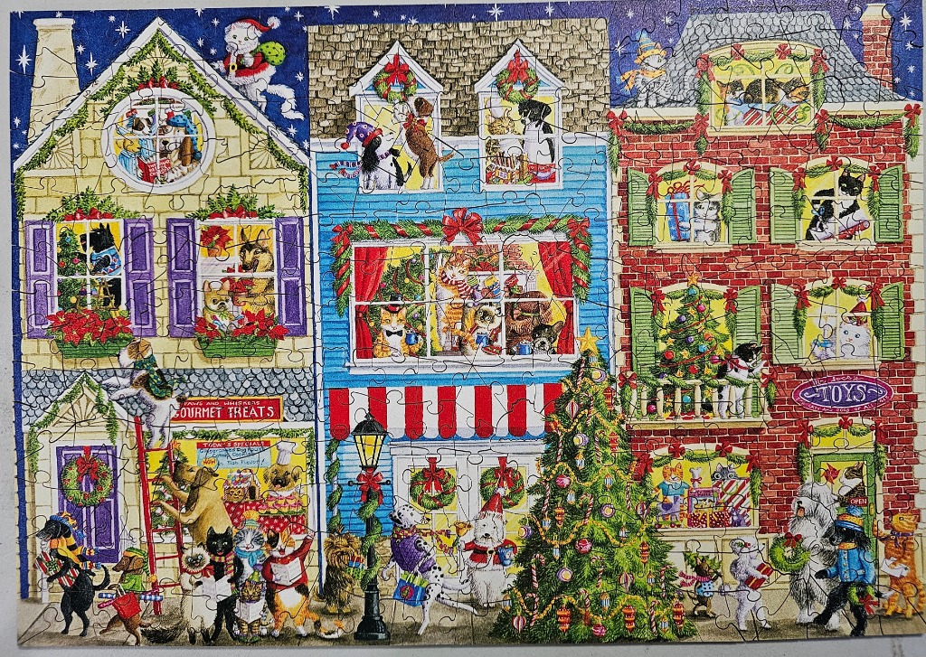 A whimsical illustration of three festive townhouses filled with dogs and cats celebrating Christmas.