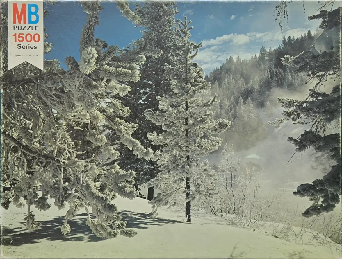 A wintry scene featuring frosted evergreen trees in a snow-covered landscape under a clear blue sky.