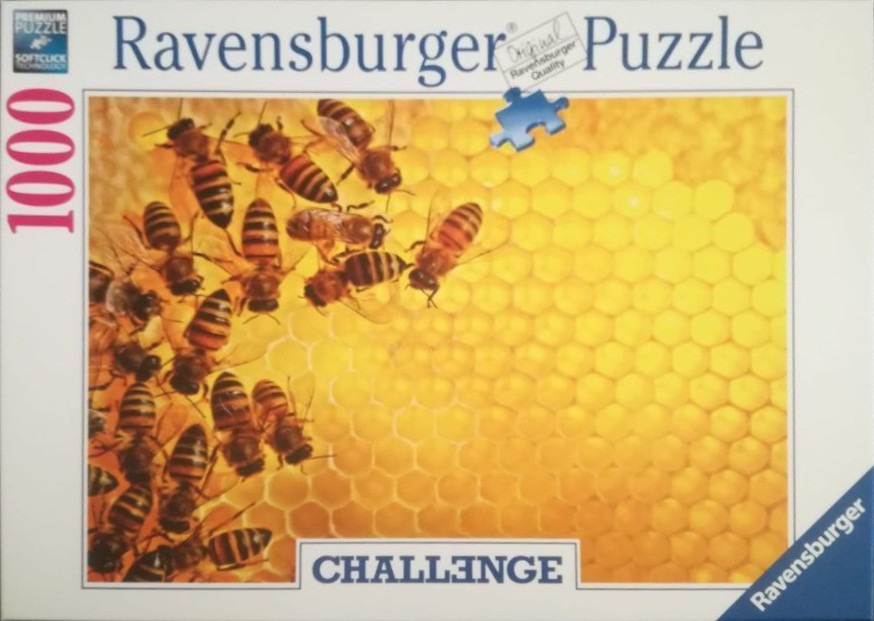 A close-up photograph of honeybees crawling across a golden-yellow honeycomb.