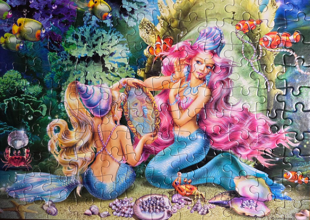 Two mermaids grooming themselves in an underwater scene filled with colorful coral and sea life.