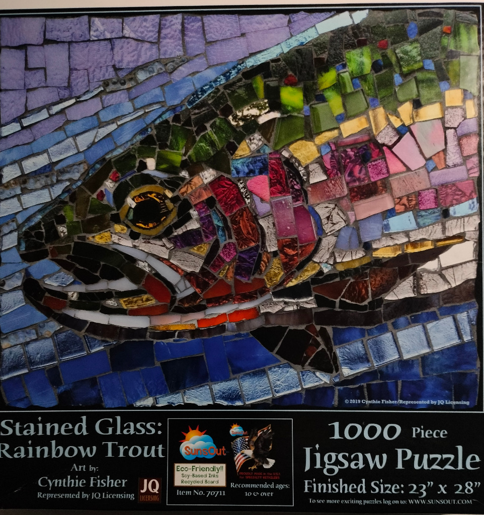 A mosaic of a rainbow trout made from colorful stained glass pieces