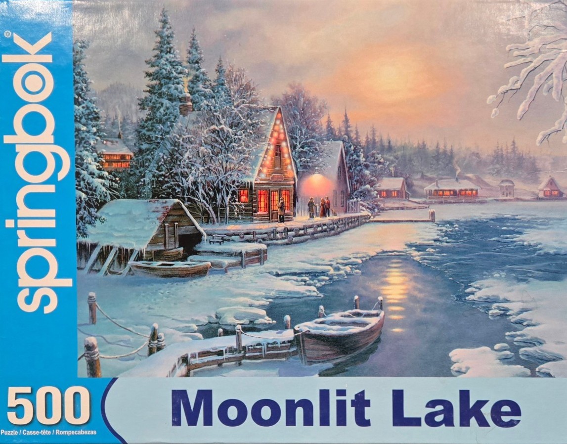 A cozy winter scene featuring a snowy cottage by a lake under a warm sunset sky.