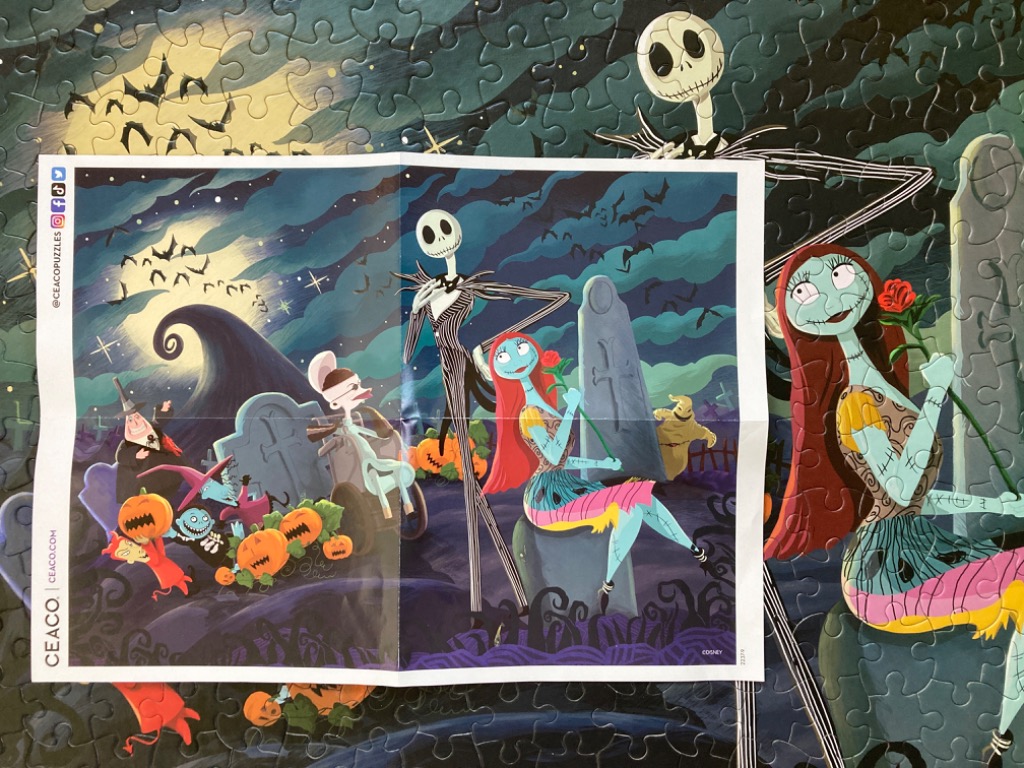 Jack Skellington and Sally in a graveyard scene with other characters from The Nightmare Before Christmas.