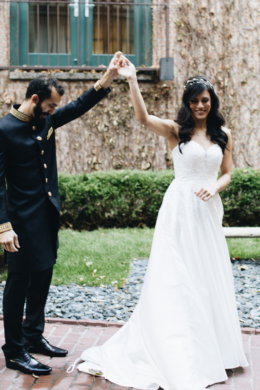 Couple dancing in courtyard