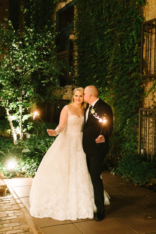 Couple in courtyard with sparklers