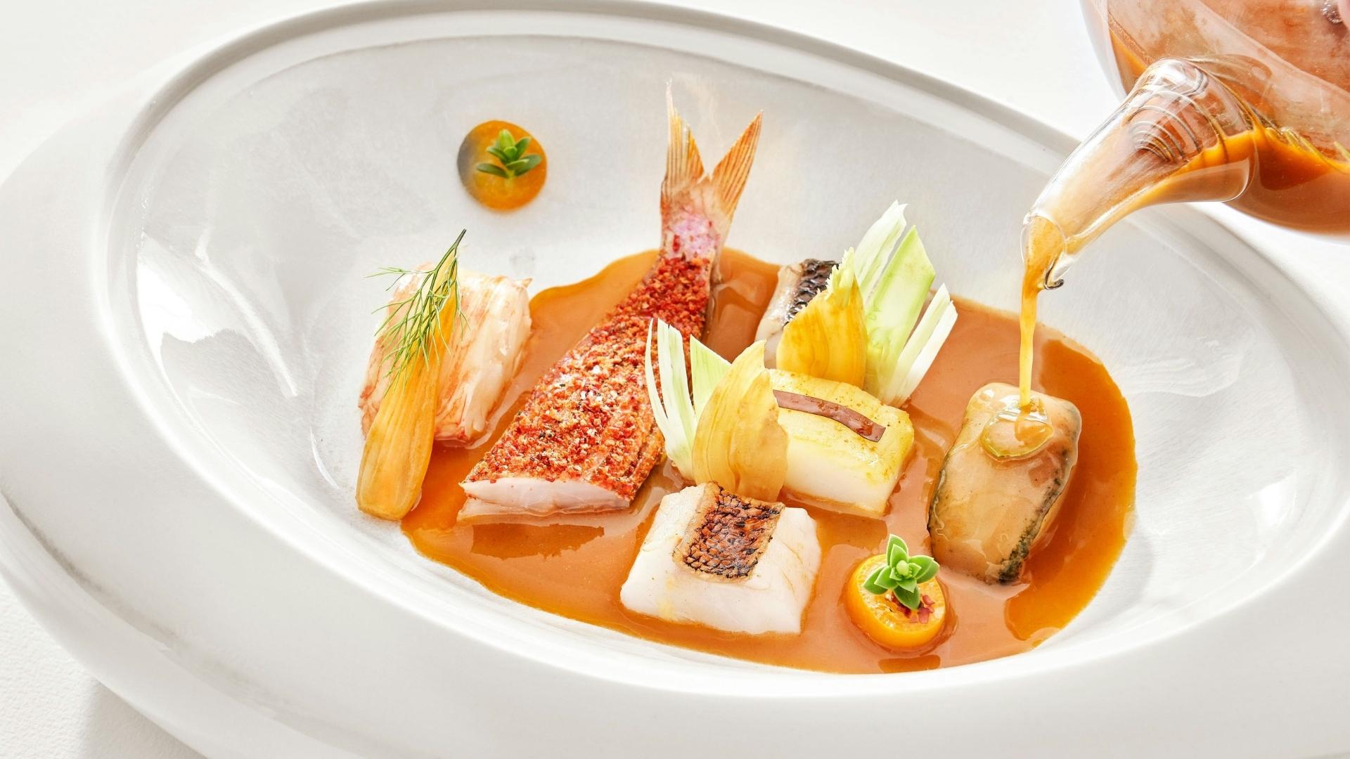 close up of plate with fish from la vague d'or st tropez michelin restaurant