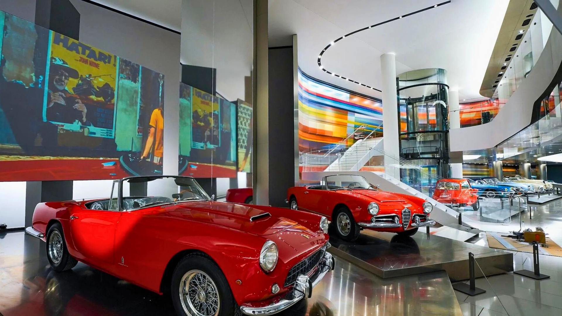 2 red classic cars in the top cars collection museum of monaco