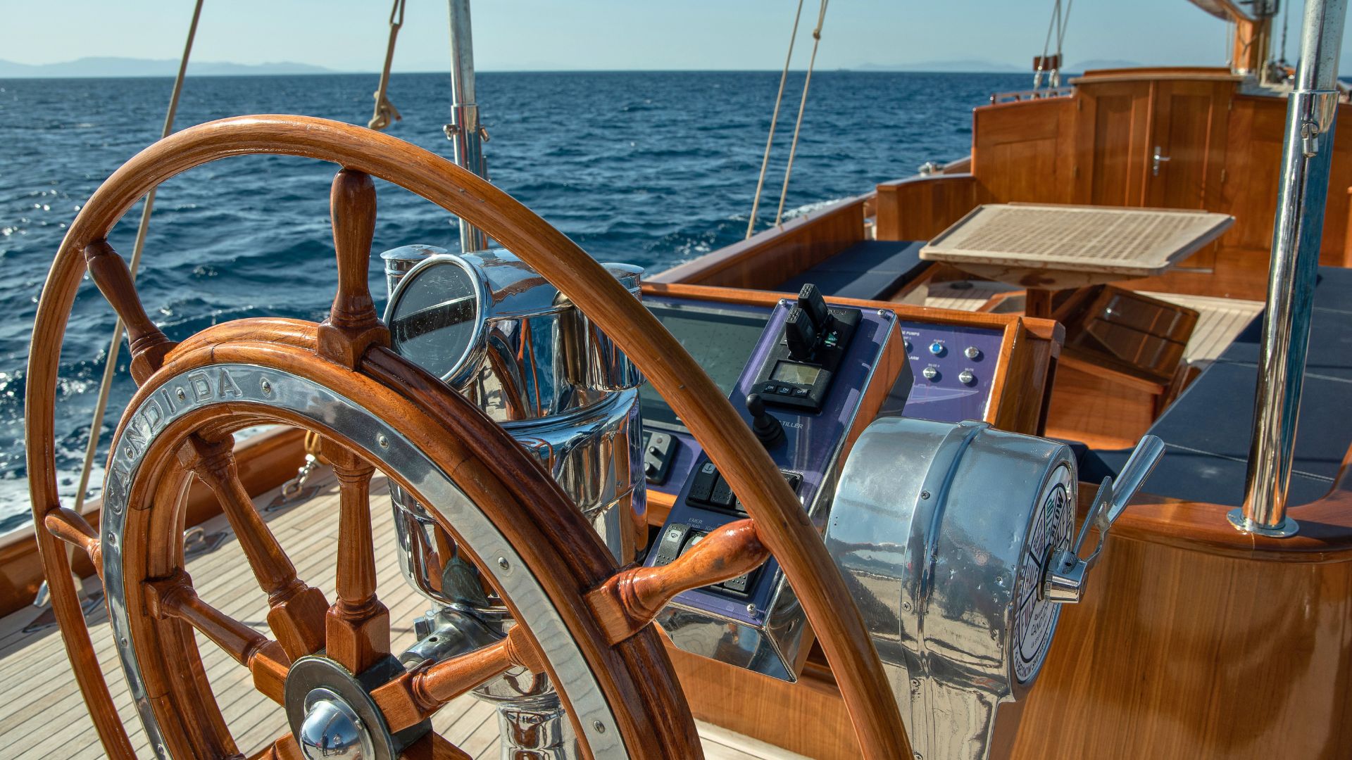 the helm of the classic yacht candida