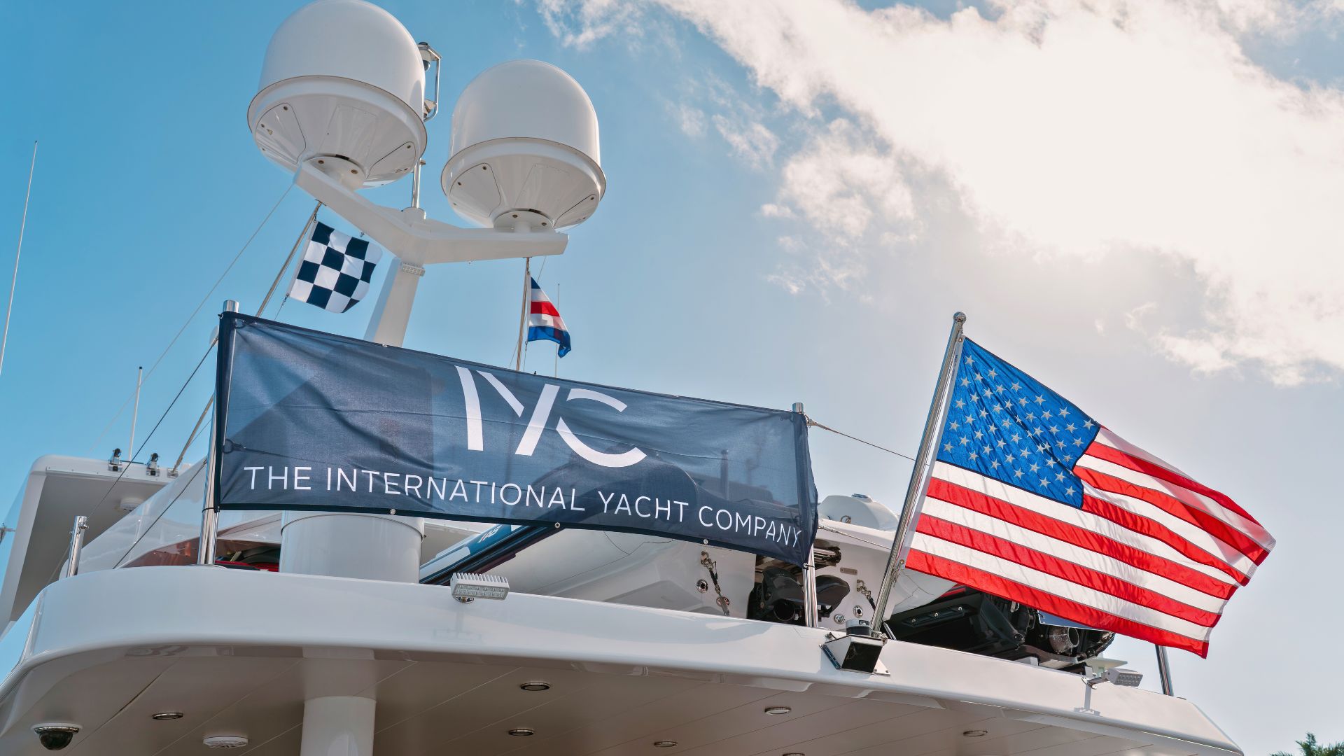 an iyc banner and the american flag on an iyc yacht during flibs