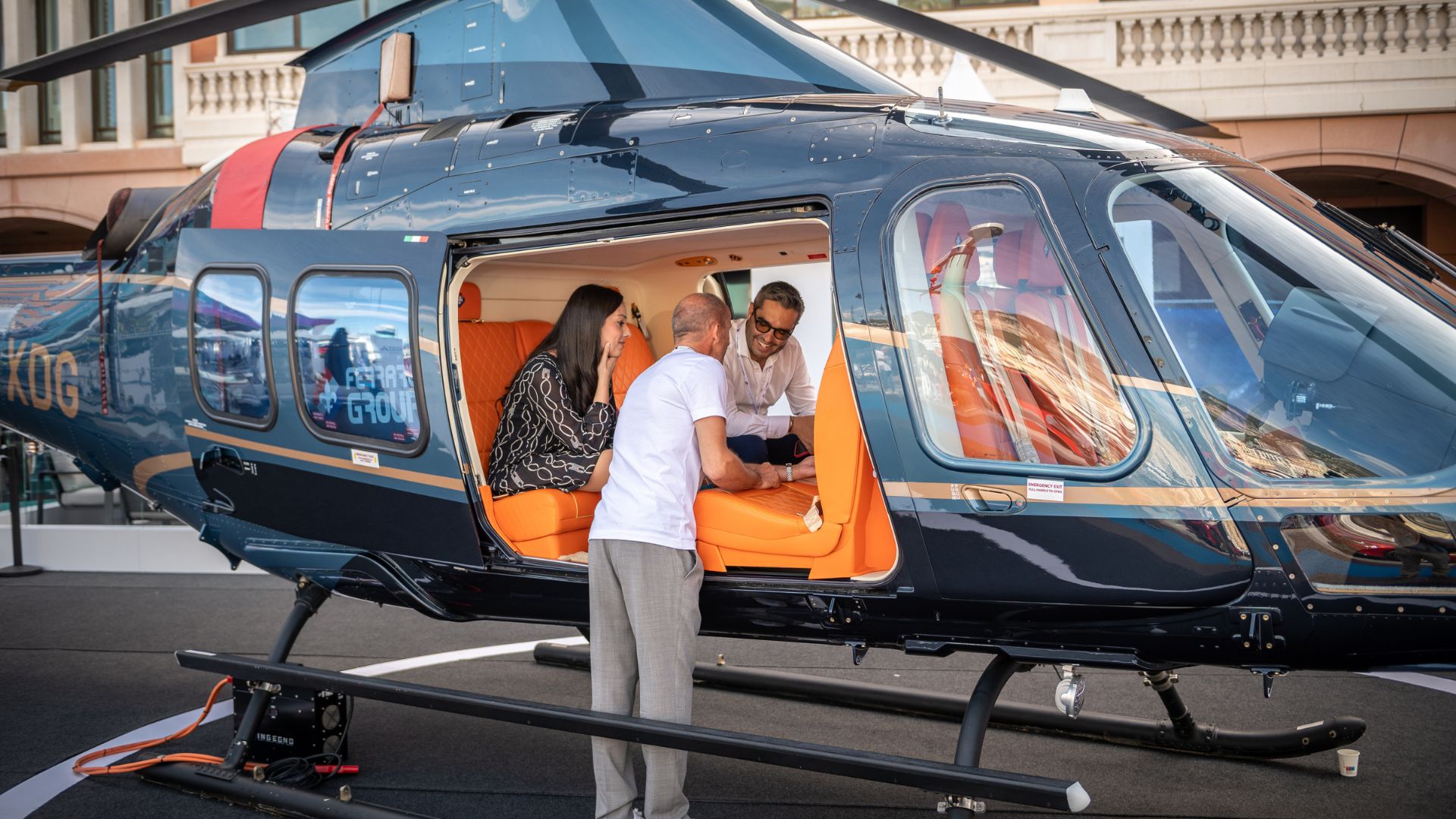 people viewing a helicopter at the adventure area of the monaco yacht show