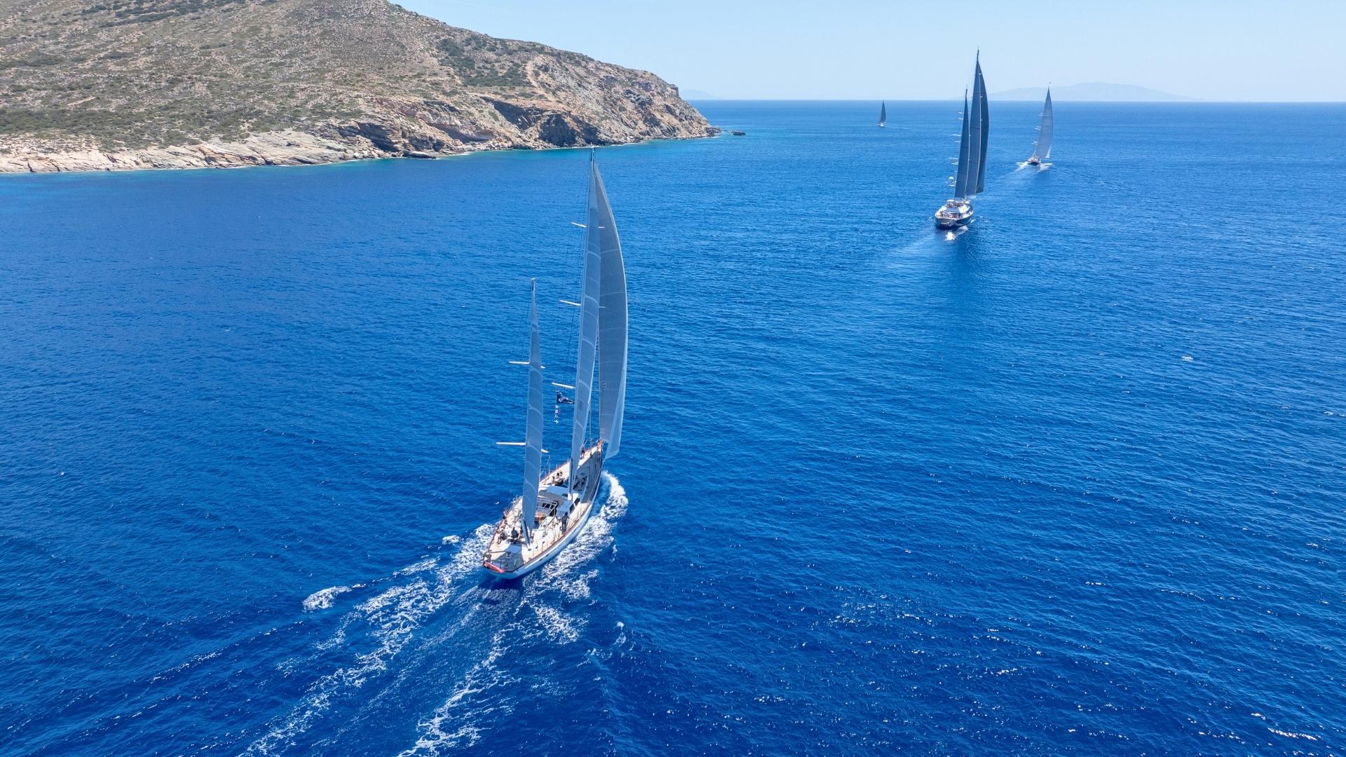aerial view of 3 sailing yacht at the the cyclades cup sailing by antiparos